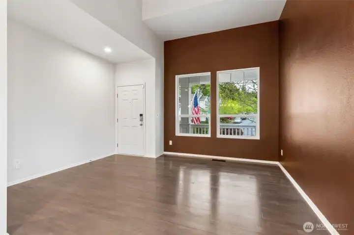 Living room view, I really love the large windows and the warm color, plus the floors throughout this level are GORGEOUS.