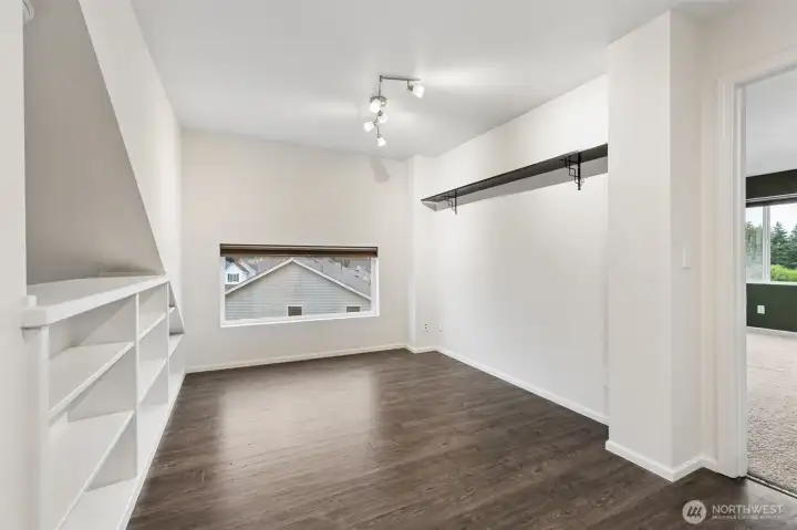 As you head upstairs, you will find this bonus loft with gorgeous (and quite sturdy!) built-in bookcases/shelving. I love the added window as well. Great for a home office, kids playroom, workout area, or??