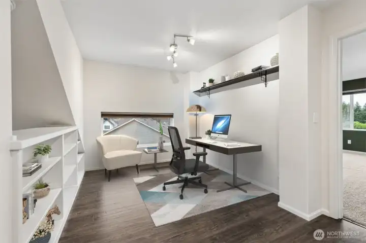 As you head upstairs, you will find this bonus loft with gorgeous (and quite sturdy!) built-in bookcases/shelving. I love the added window as well. Great for a home office, kids playroom, workout area, or?? ***Virtually Staged***