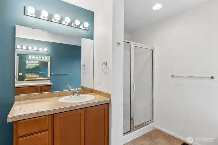 Primary ensuite bath view two showing the other vanity and separate shower, water closet is in it's own room as well! I call it the "marriage saver" :)