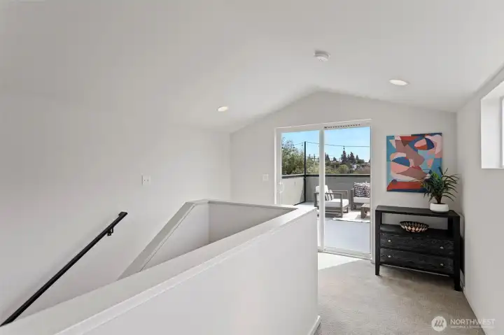 Top floor landing between rooftop deck and primary bedroom.