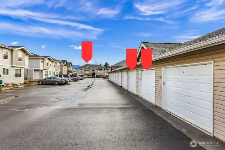 Two private garages as well as two  dedicated uncovered parking spaces directly  in front of units