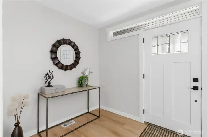 This crisp and clean entry and new front and back door says it all about the stunning remodel. This crisp and clean entry and new front and back door says it all about the stunning remodel.