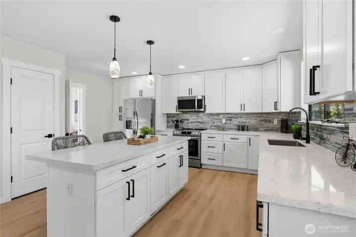 Here is the dream kitchen, quarts countertops, tons of cabinets and drawers, two pantry's and an extra storage closet. Here is the dream kitchen, quarts countertops, tons of cabinets and drawers, two pantry's and an extra storage closet.