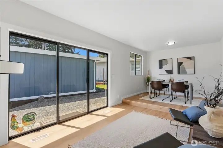 Family room has a slider that leads to another patio in between the house and garage. Family room has a slider that leads to another patio in between the house and garage.