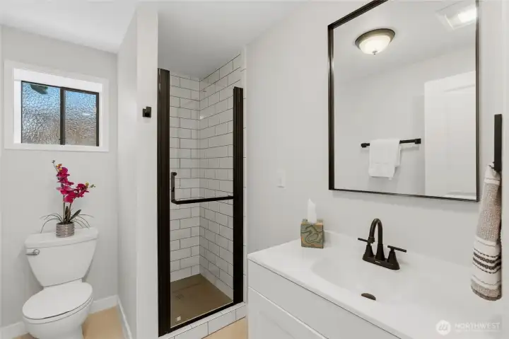 Bottom level also has 3/4 bath and is crisp and clean. Bottom level also has 3/4 bath and is crisp and clean.