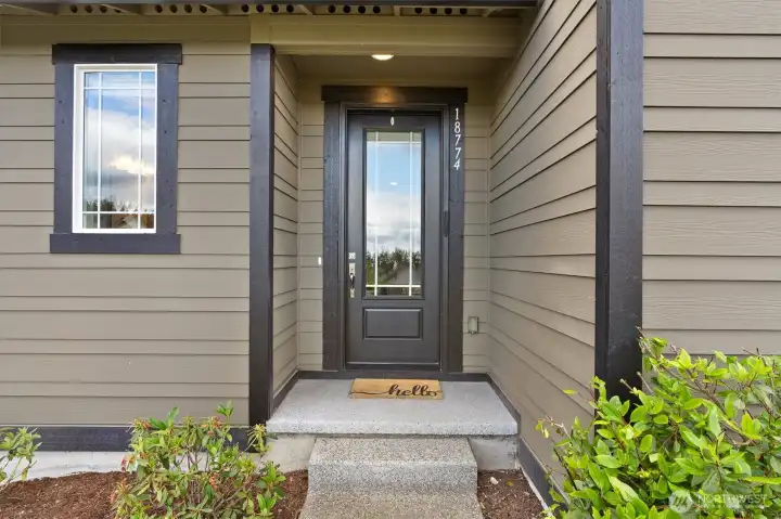 Front door, entry way that opens to a public grass area Front door, entry way that opens to a public grass area