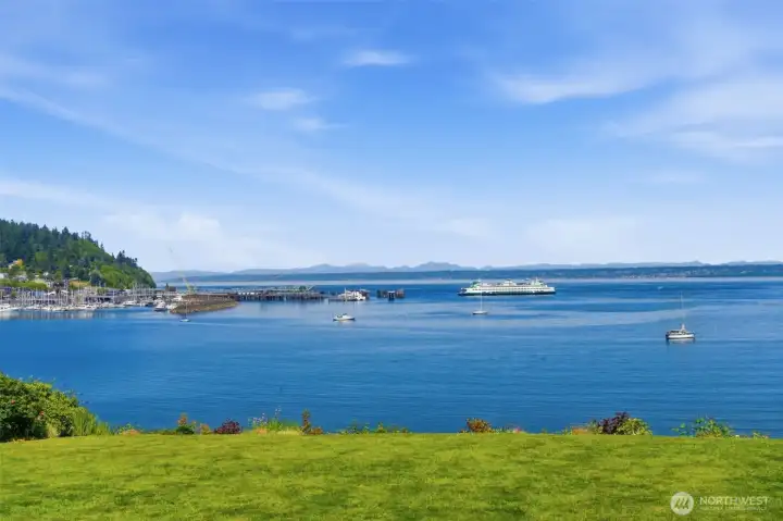 Puget Sound shipping lanes, ferry and marine traffic and Cascade mountains views.