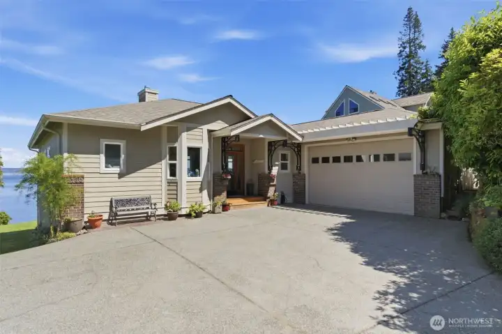 MAIN HOUSE - Front entrance to home with attached 2-car garage.