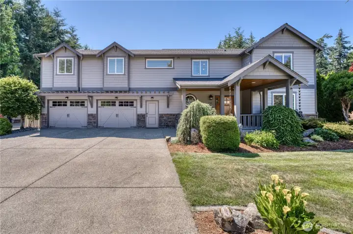 Beautifully remodeled home with a large 1,489 Sq ft heated shop on a flat private acre with partial Sound views in the gated community of Cedrona Estates.
