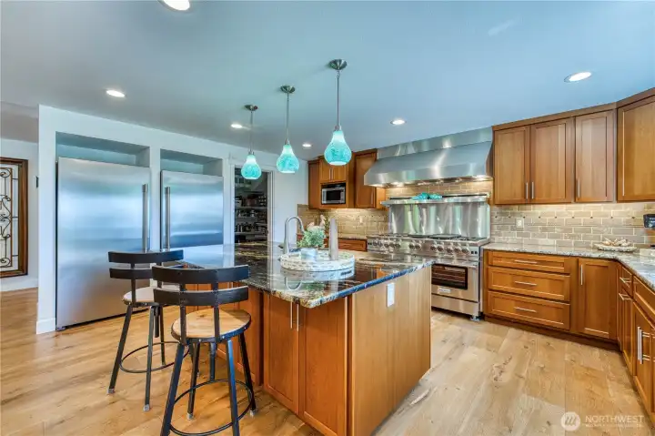 With separate full-size refrigerator and freezer, large island and walk in pantry this home is so easy to entertain in.