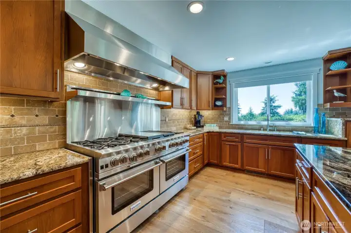 Commercial-grade 10-burner BlueStar range with griddle and flat top...imagine entertaining in this home!
