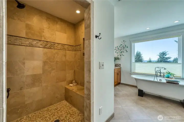 Spa inspired custom tile shower with seated bench.