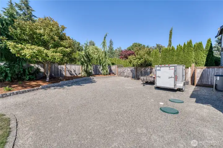 Additional area in the side yard to park an RV and hook up to power and ability to dump.  Or store other toys?  You decide.