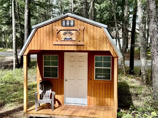 More than a shed. Front porch and windows makes this a shed with possibilities!