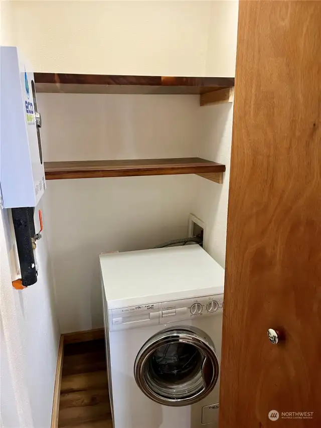 Main level washer dryer closet.