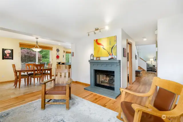 Gas fireplace, hardwood floors and circular flow in this main floor living area