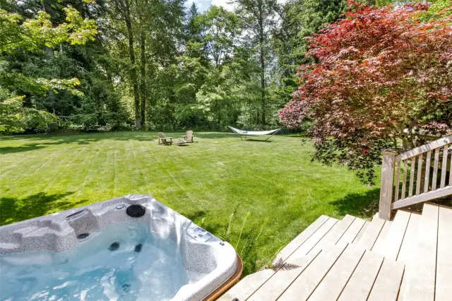 Relax in your hot tub while enjoying the serenity of your park-like yard