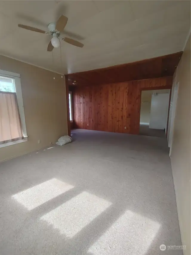 Living room showing kitchen entrance