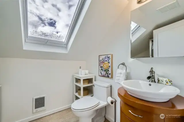 Upstairs bath with skylights.