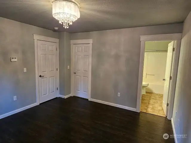 15909 - The primary bedroom with its own walk-in-closet.