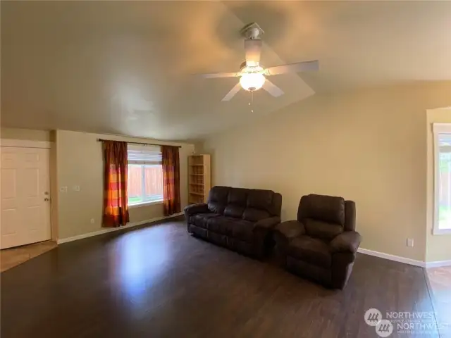 15907 - Spacious living room with vaulted ceilings and tons of natural light.