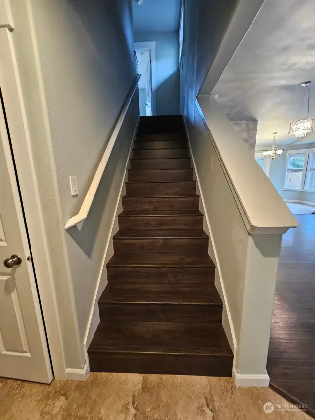 15909 - Foyer opens into the living room on the right, stairs to go up in the middle, and a coat closet to the left.