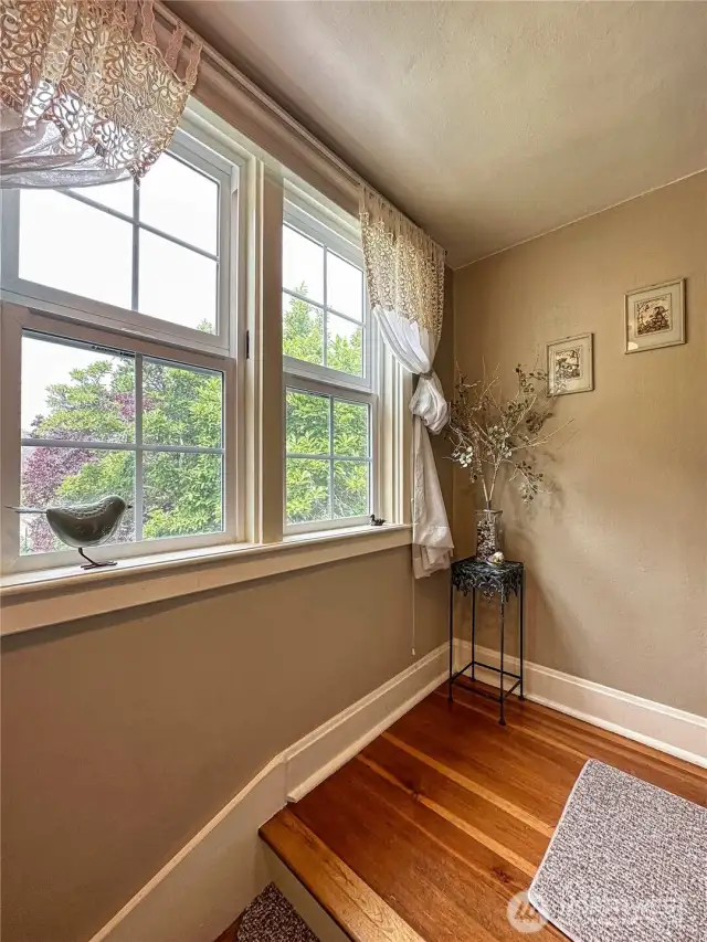 Plenty of natural light is provided in stairwell and landing to upper level