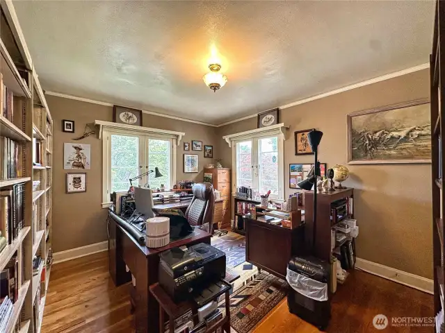 Versatile Bedroom 1 on main level functions as a home office