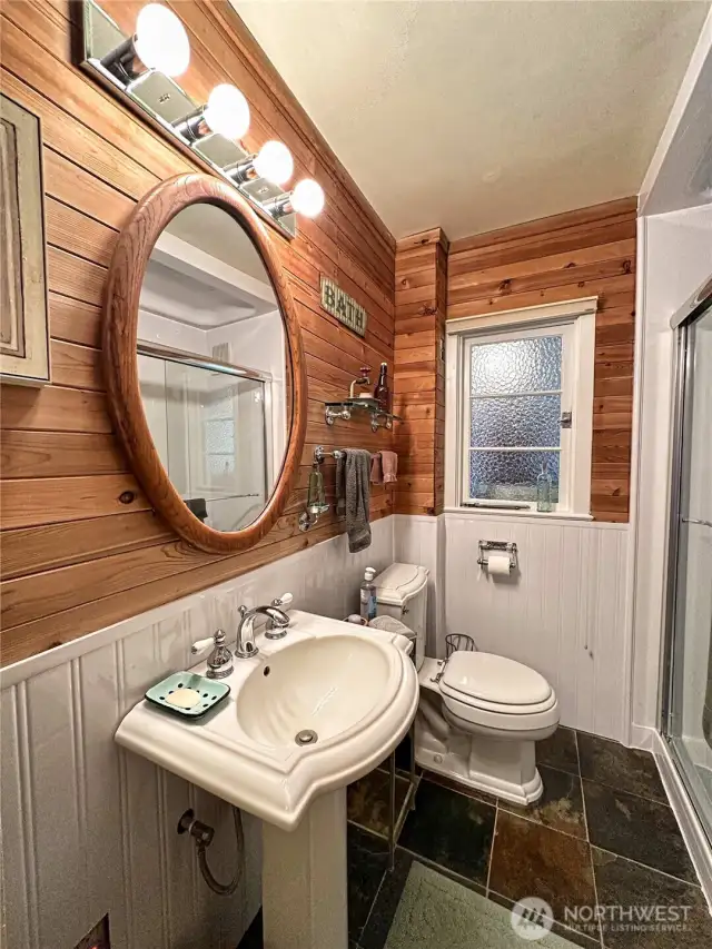 Main floor bathroom with refreshing Bath Fitter walk-in shower reno