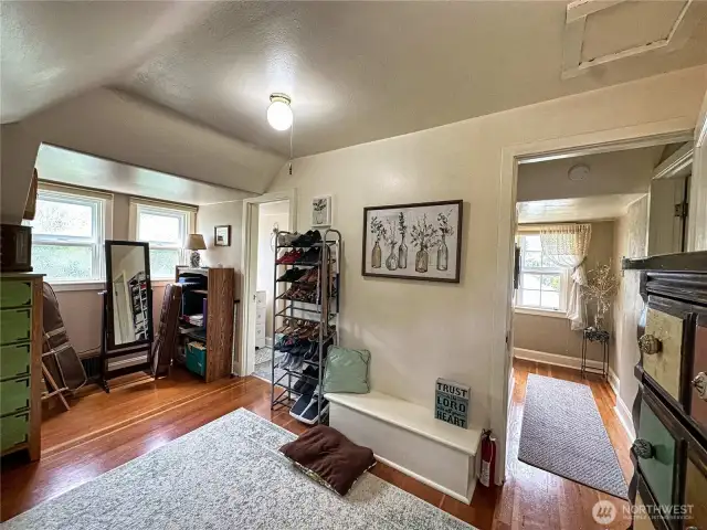 Upstairs dressing area/primary bedroom with half bath