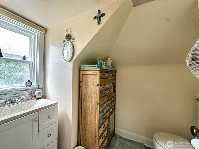 Half bath off upstairs primary bedroom space