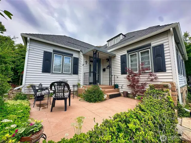 This 1934 home captures the enduring appeal of Cape Cod architecture. This front patio space is perfect for morning coffee and afternoon wine.