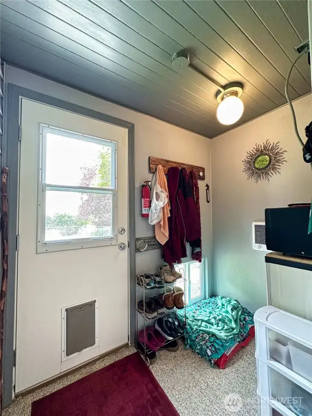 Access to fenced back yard & patio space complete with doggie door