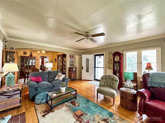 Classic hardwoods carry throughout home with timeless built-ins and archways