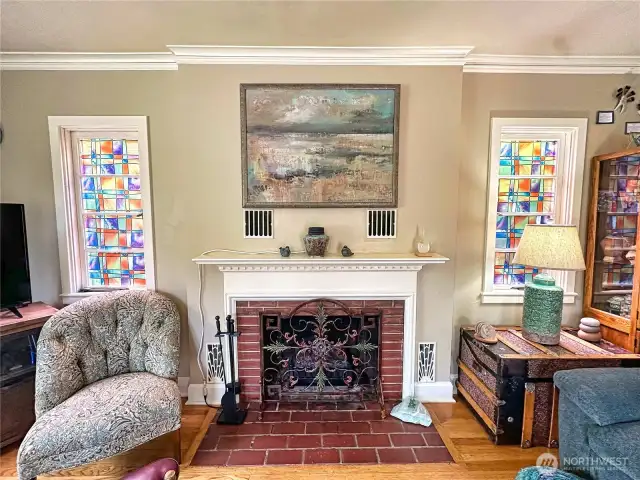 The fireplace is a focal point that complements the room's airy atmosphere, making it the perfect place to unwind and enjoy the peaceful surroundings