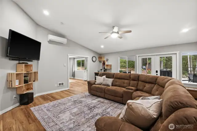Whether you gather indoors to watch a movie, or wander to the covered deck off this room, the indoor-outdoor transitioning is seamless.