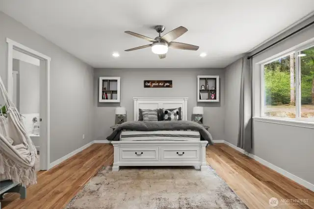 A beautiful primary ensuite bedroom is spacious and bright!