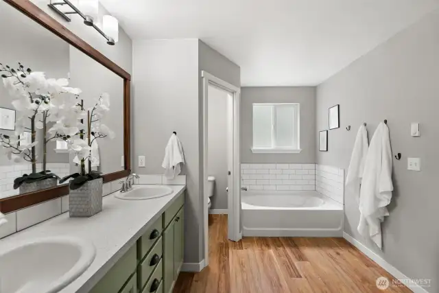 The five piece bathroom includes dual vanities and a soaking tub where you can relax after a long day.