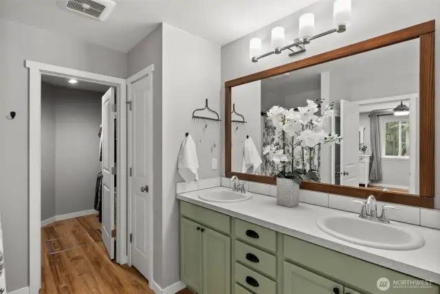 A walk in closet adjoins the bathroom offering a space to organize your wardrobe.