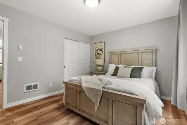 One of the three additional bedrooms, apart from the primary bedroom.