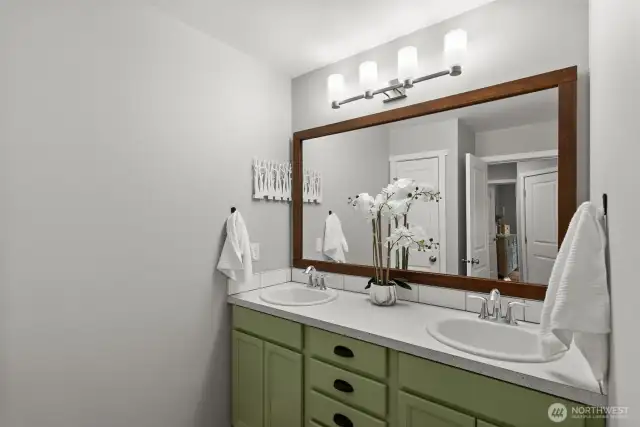 A shared full bathroom is conveniently located between the bedrooms for ease and comfort.