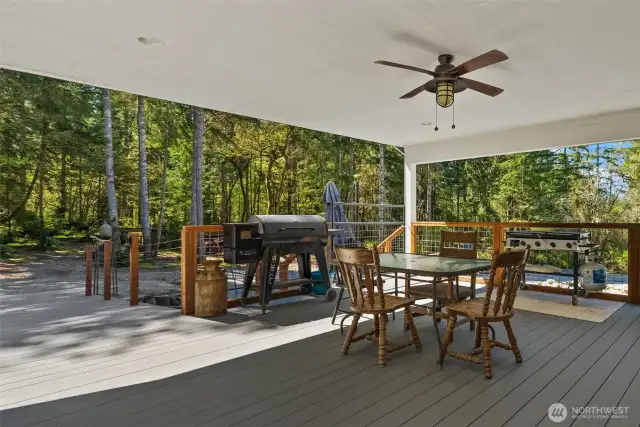 A large covered outdoor living area will quickly become your favorite summer hangout, featuring access to an expansive deck, pool, and hot tub for the ultimate summer experience.