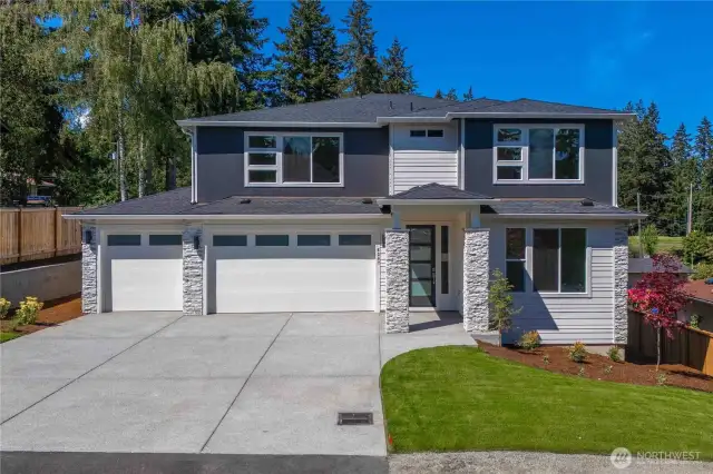 Home is a 3 car garage, but exterior style will be more farmhouse - like next photo. For Marketing purposes only