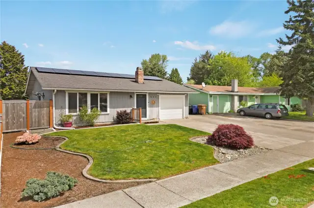 The curb appeal is enchanting, but this amazing home lives up to it inside and out! Absolutely turn-key and move-in ready, it has an open floor-plan you'll love, with spacious living areas, incredible finishes and colors, and recently updated kitchen and bath that will delight you. Rooms are spacious and the primary bedroom is especially expansive. Solar panels are already installed and fully operational (at a cost of about $26,000!) so you'll enjoy cost efficient green energy. The garage includes space for a workshop, and the private, fenced and manicured backyard includes three patio seating areas! There's a roomy garden shed with a ramp to make mower access easy. You've got to see this amazingly updated home!