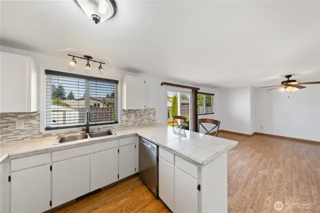 Kitchen w/ eating bar.  Opens to family room.  Air conditioned, too!