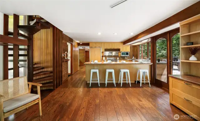 The kitchen and family room area with French doors to the main deck.