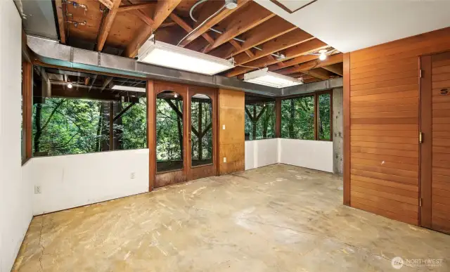 Another room on the lower level with built-in sauna at right.