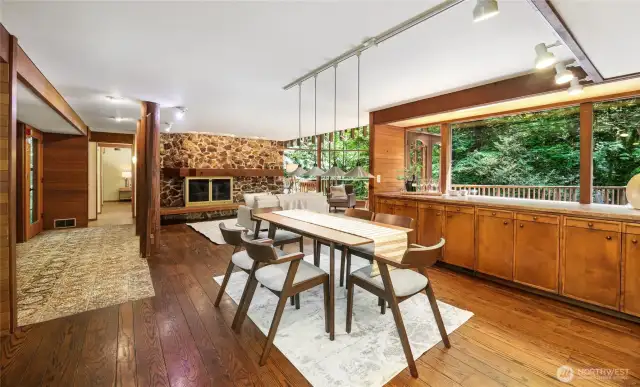 Another view of the dining area toward the living room and the primary suite beyond.