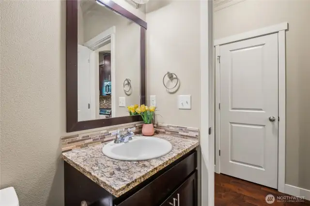 Main level bathroom adjacent to laundry